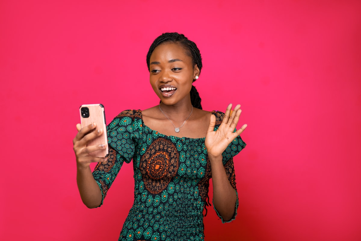A MileTrades trader checking her phone